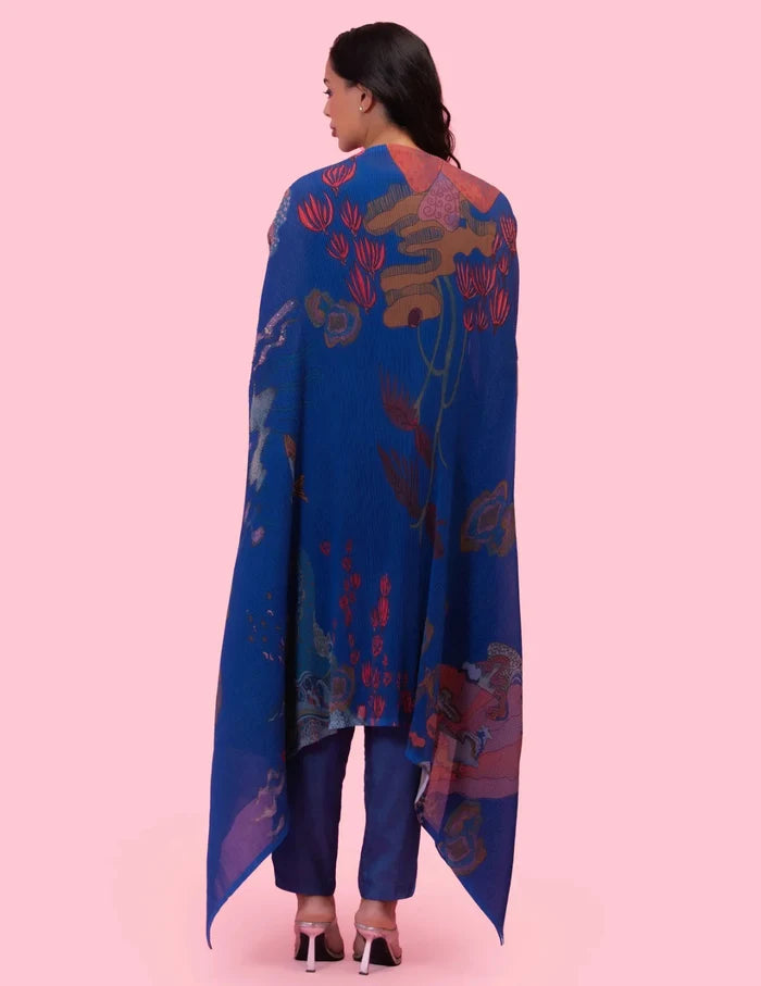 Model wearing the 'BRAHMAND BLUE' kurta set with a straight-fit Dola silk kurta, matching pants, and a statement printed georgette cape.