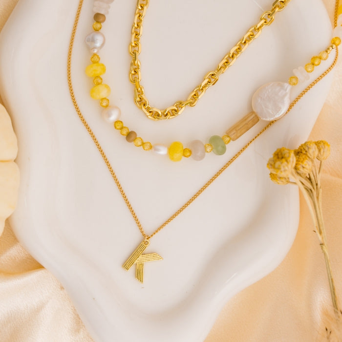 taudrey golden ease necklace stack
