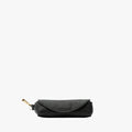 STOW London's Lipstick Case in Black pebbled leather featuring a gold-coated stainless steel clip on a light grey background