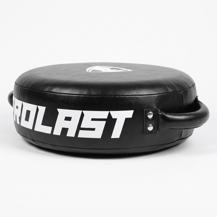 PROLAST round punch shield in black, side view of the thick rim with large white PROLAST lettering